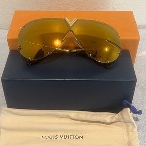 Like new Louis Vuitton sunglasses. Gold with case